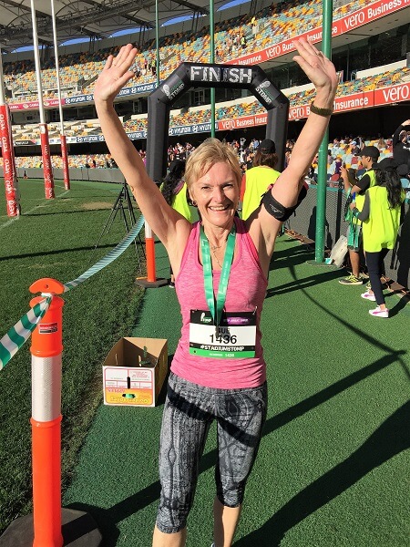 Sue from Sizzling Towards 60 and Beyond completing a marathon