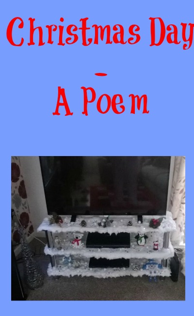 Christmas Day - A Poem in red text on an icy blue background with a picture of a Christmas scene