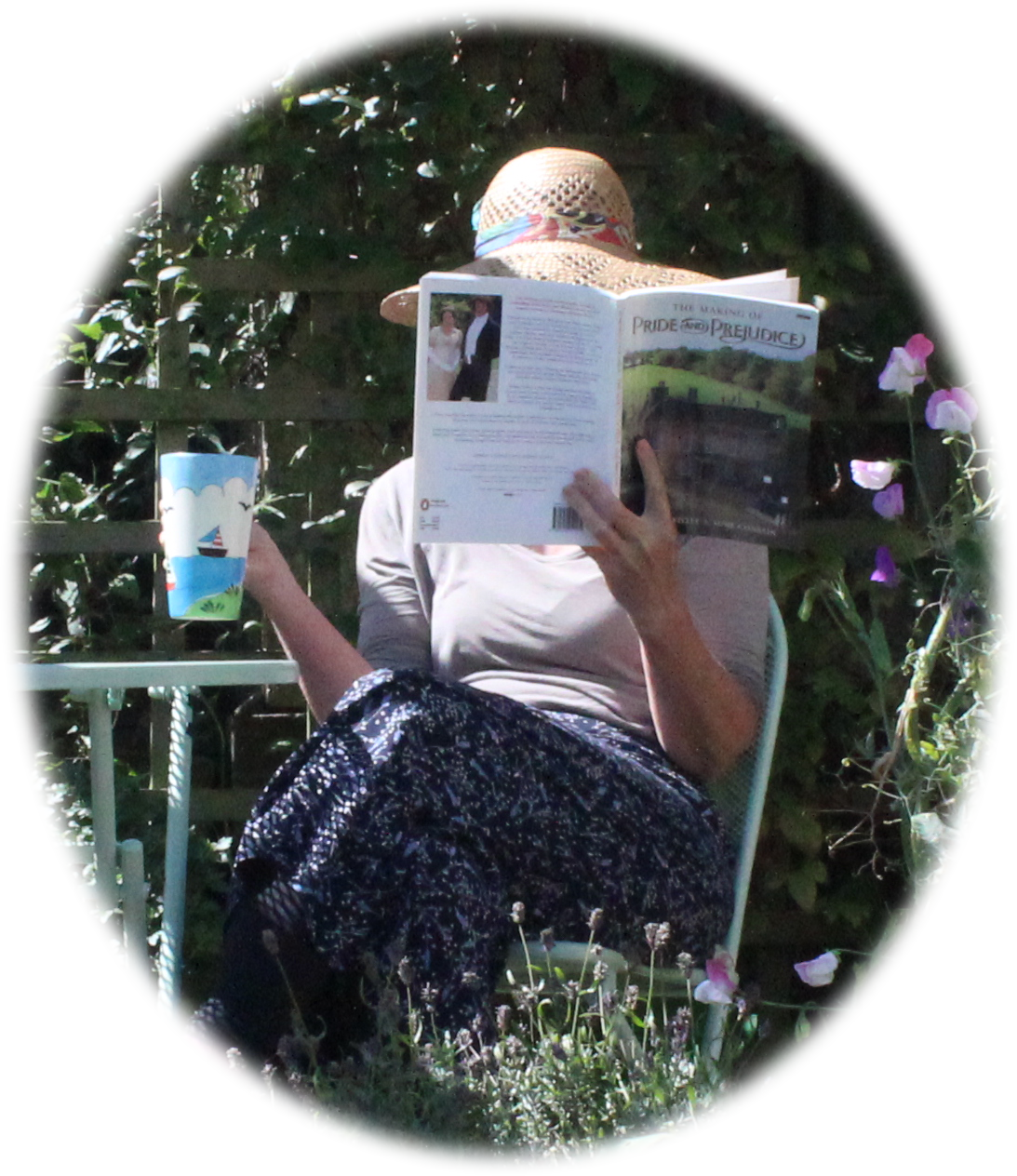 Jayne Davis with a book and a drink