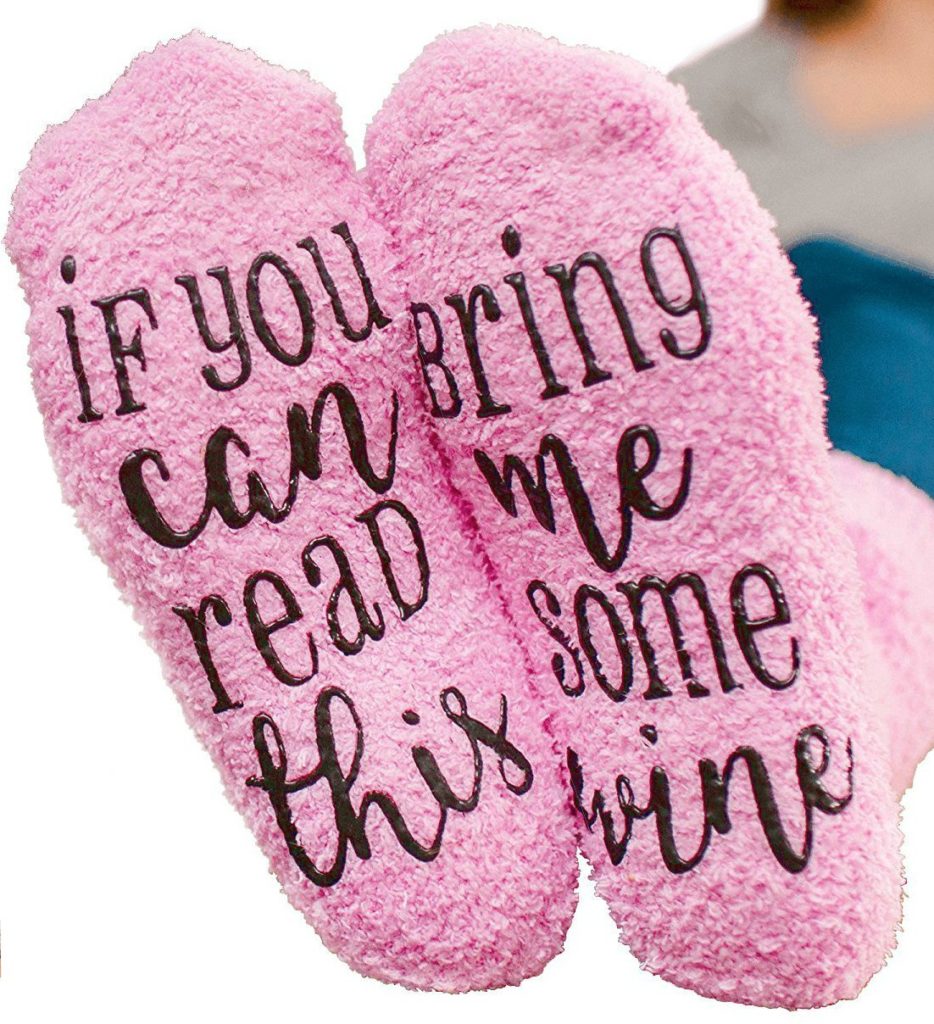 Pink socks with the message "if you can read this, birng me some wine" on the feet