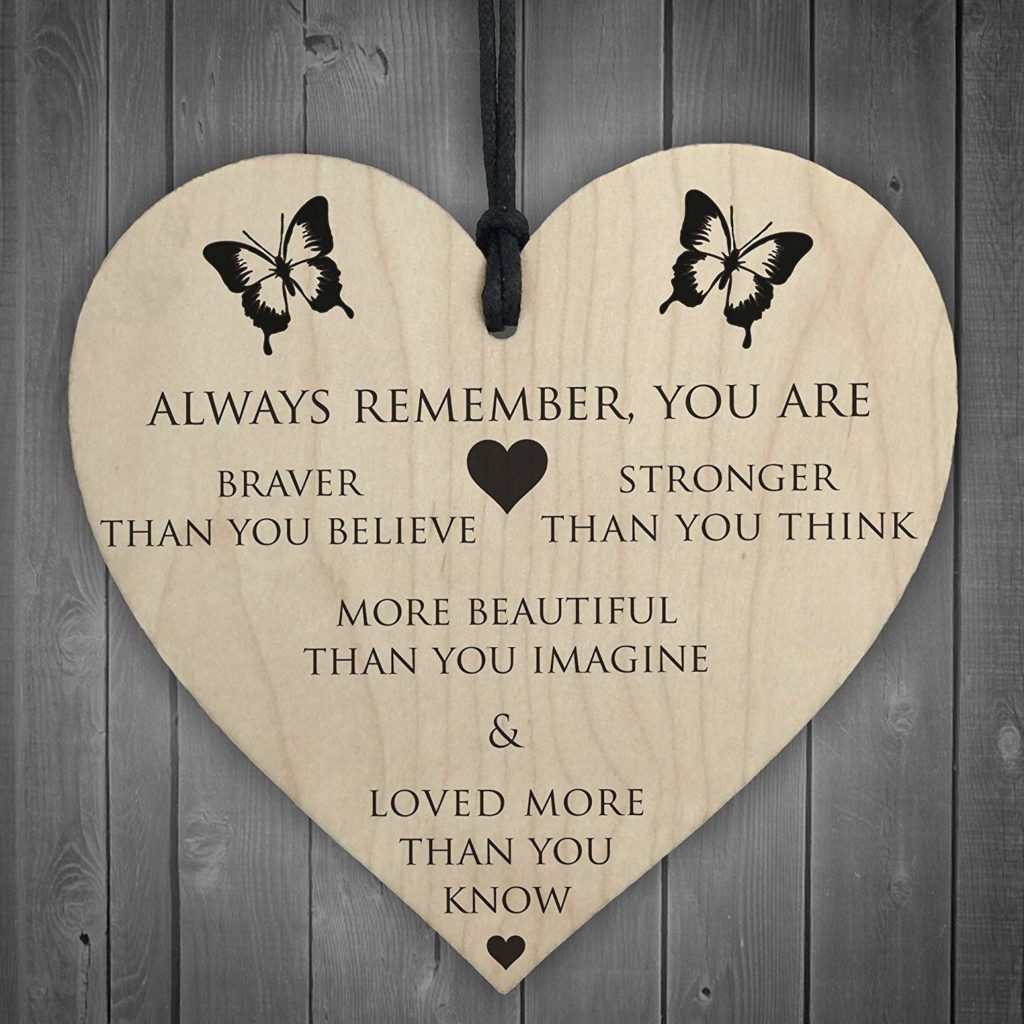 Wooden heart with the message "always remember you are braver than you believe, stronger than you think, more beautiful than you imagine and loved more than you know"
